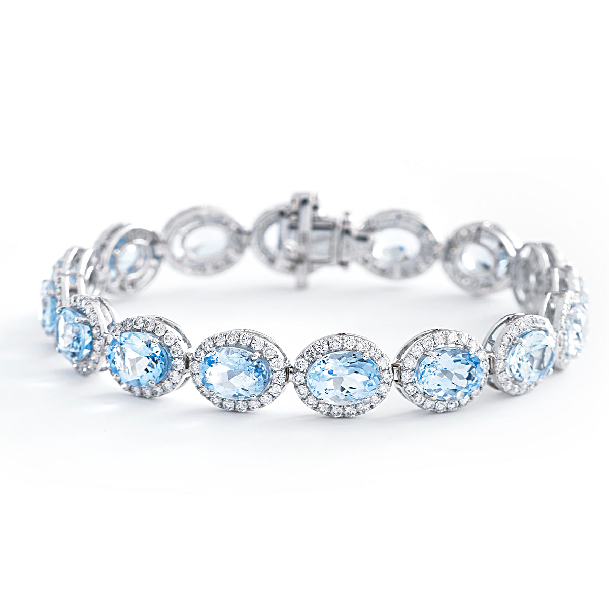 Blue Sapphire and Diamond Halo Tennis Bracelet in White Gold | New York  Jewelers Chicago